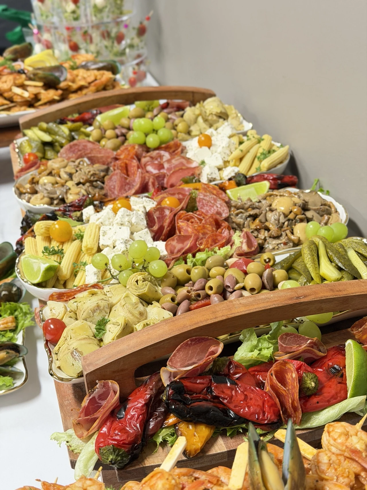 A generous antipasti display with cured meats, cheese and vegetables