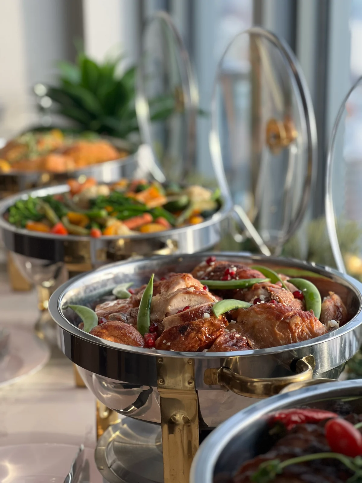 Hot wedding buffet dishes prepared for dinner service
